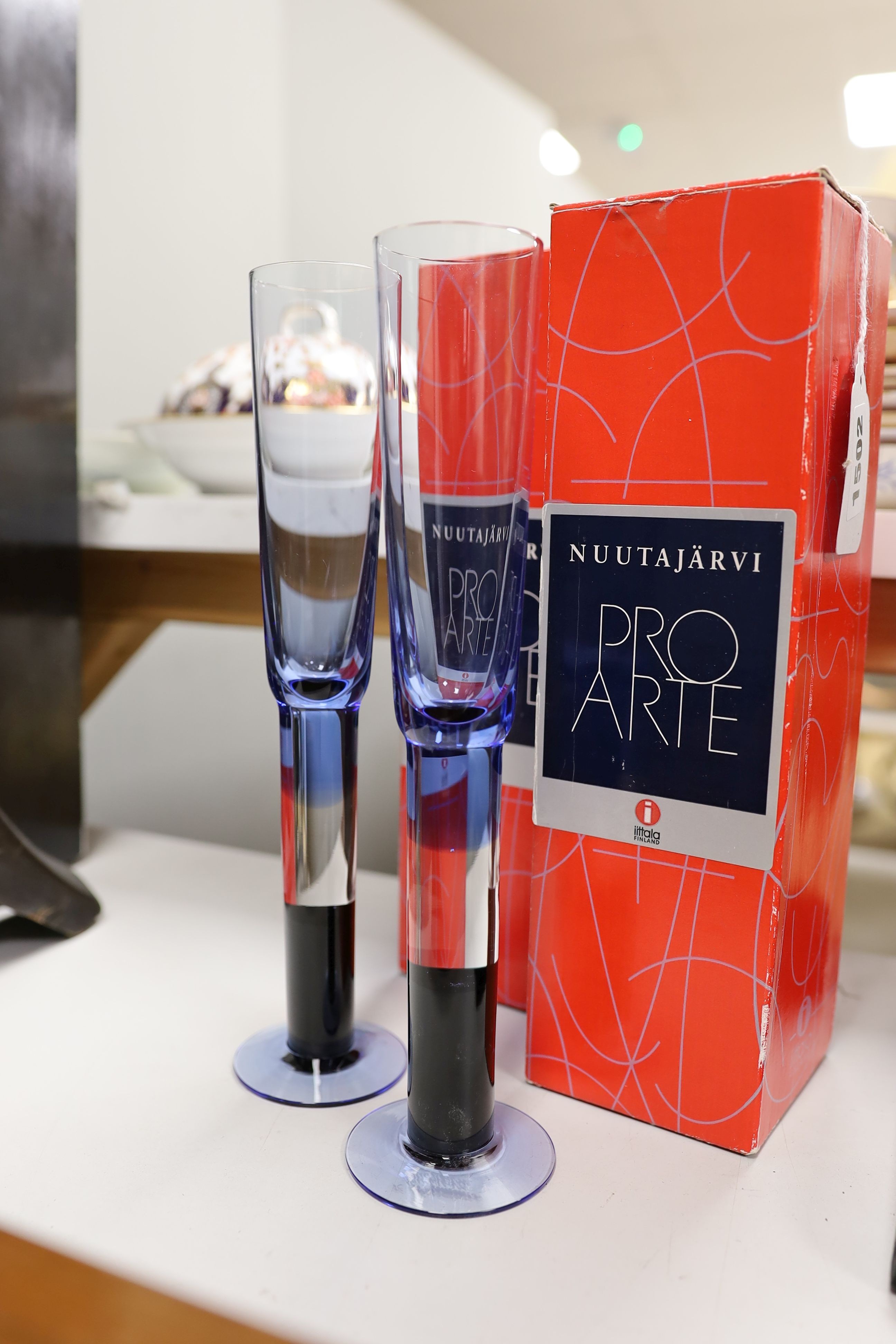 Two boxed Iittala Nuutajarvi Pro Arte Cordial glasses, signed K Nurminen Nuutajarvi, 25 cms high.